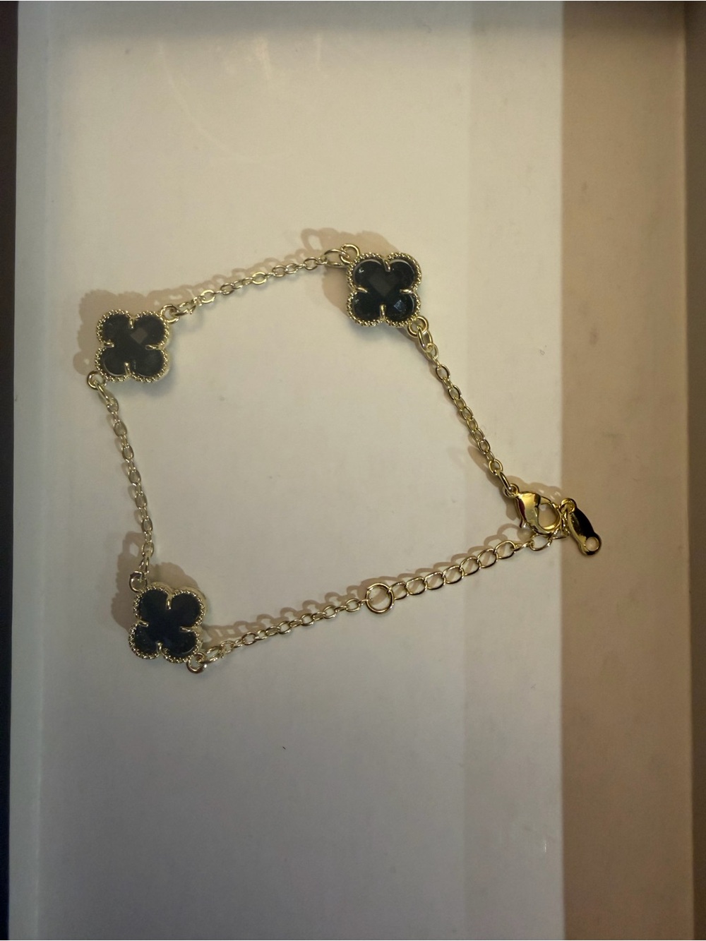 Gold Chain Bracelet with Black Clover Accents